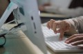 A woman working with PC or desktop at offic, shot hand only